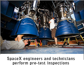SpaceX engineers inspect engines