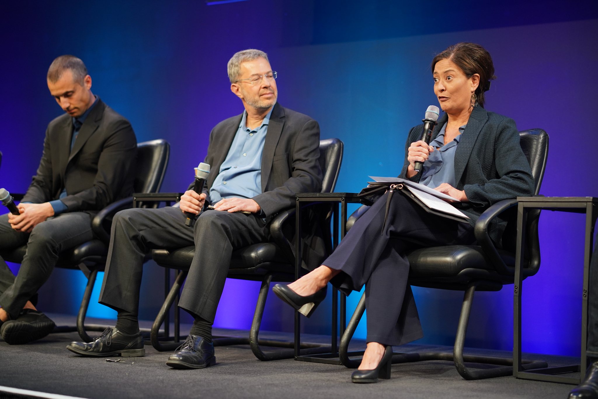 York Space Systems general manager Melanie Preisser speaks into a microphone on the buses and vertical integration panel at Silicon Valley Space Week 2026.